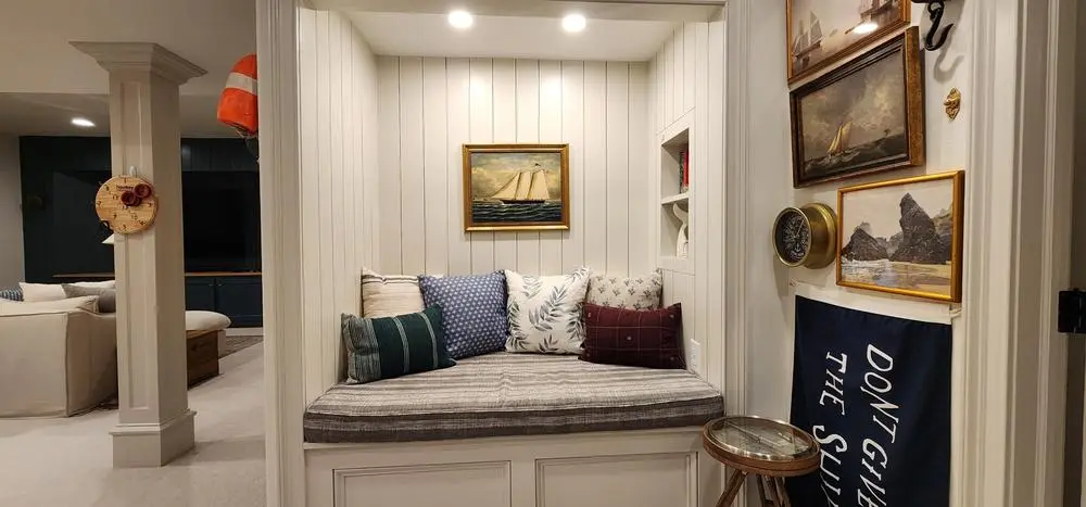 Basement window-seat nook with recessed lighting
