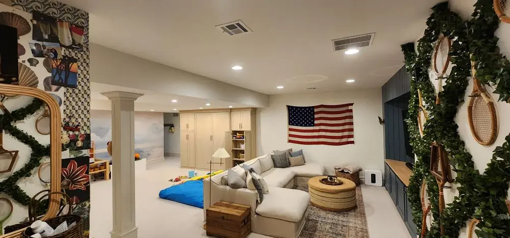 Finished basement family room with recessed lighting